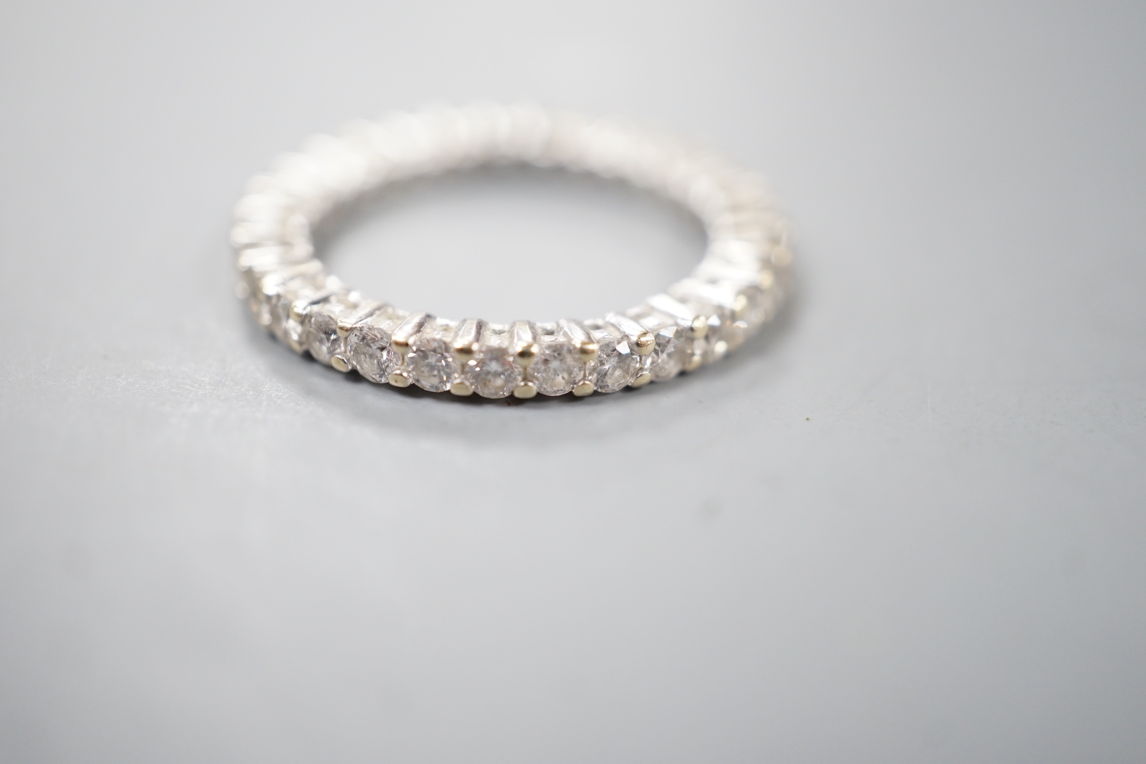 A modern 18ct white gold and diamond set full eternity ring, size M, gross weight 3.4 grams.